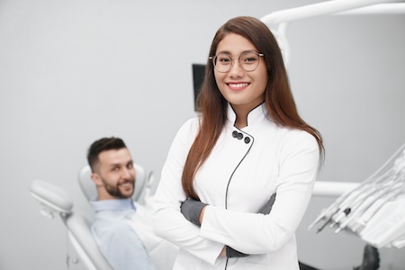 female staff in lab coat smiling